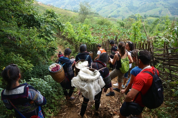 Some of the Hmong women helping our group down a muddy hill.